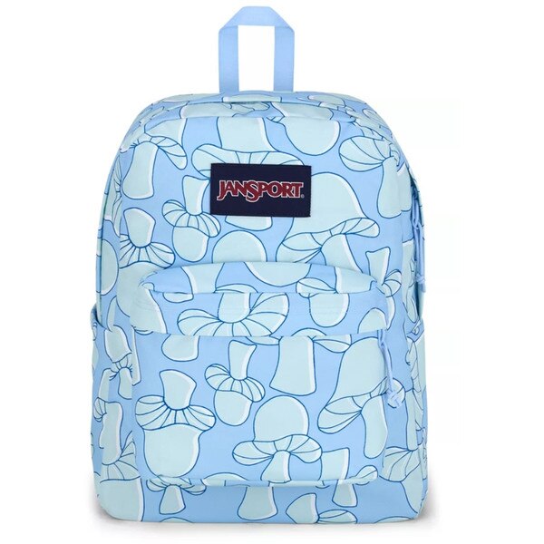 Front of light blue Jansport backpack with cartoon mushroom design all over in different shades of blue with large zipper pocket on top and zipper pocket on front, with Jansport logo.